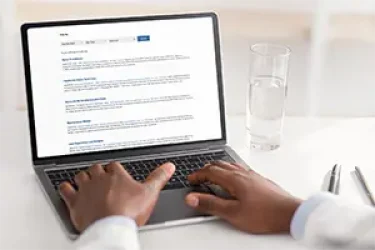 A man using the WE Data Tools Work From Home Job Board on his laptop